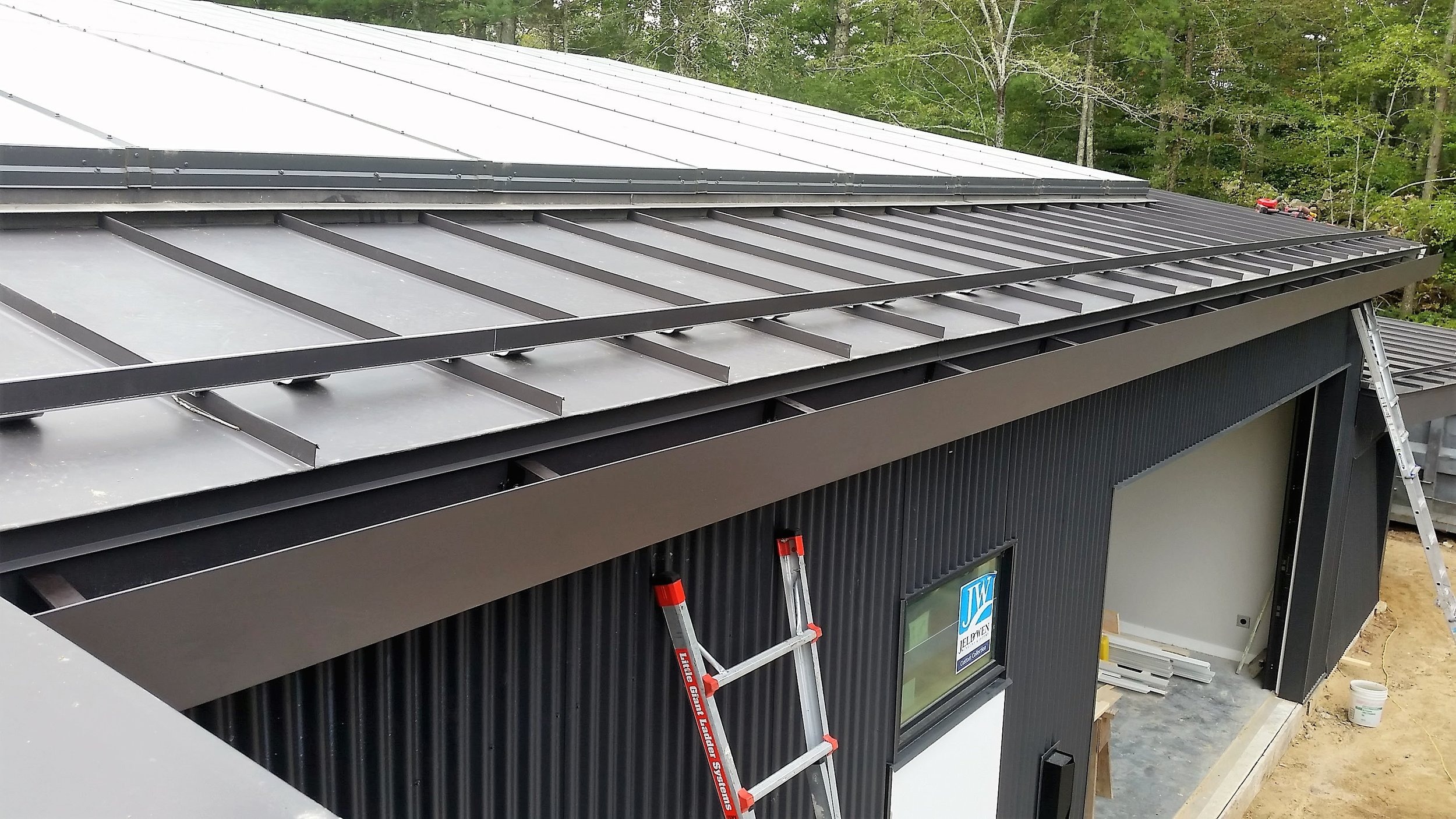 Modern Metal Roof with Integrated Gutter System for Contemporary Homes